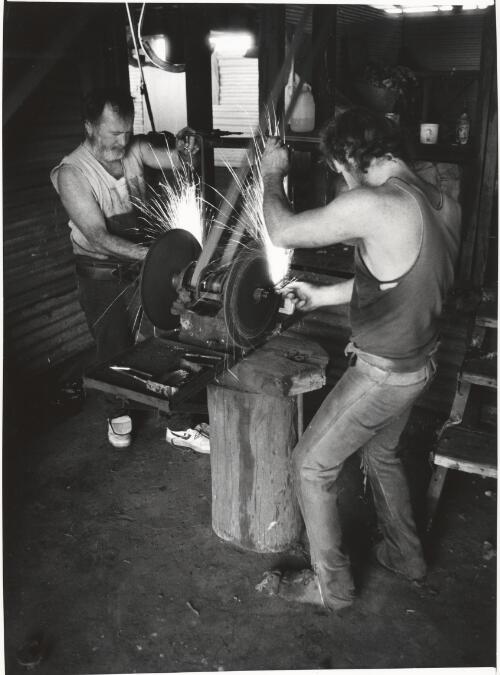 Shearers sharpening their combs at Koridina station, west of Wanaaring [picture] / Jeff Carter