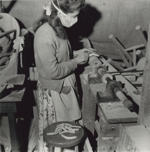 A female worker of 'Aboriginal Enterprises', making small decorative boomerangs for sale to tourists in Melbourne for the 1956 Olympic Games [picture] / Jeff Carter