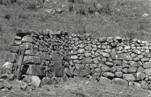 [A dry stone wall with a gate-post built by Tom Newing in the Kiama region] [picture] / Jeff Carter