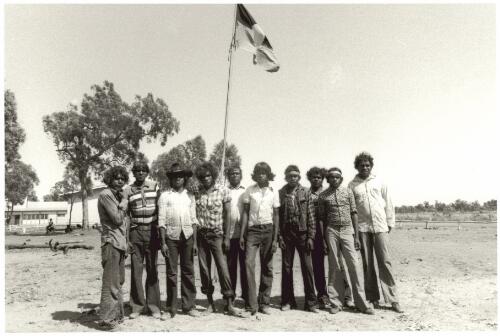 Young men on Mornington Island raise the flag on the Bora Ground, [Queensland] 1978 [picture] / Juno Gemes
