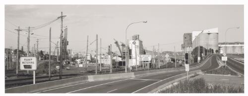 Power poles, railway tracks, silos and the road to Anzac Bridge, Glebe Island, New South Wales, ca. 1998 [picture] / David Kay