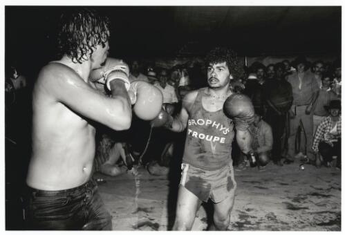 Brophy's Boxing Troupe, two men engaged in a boxing match, one bloodied, Birdsville, Queensland, 1988 [picture] / Charles J. Page