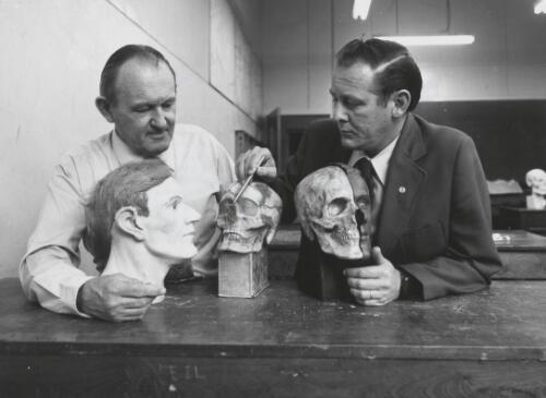 Mr English, left, and Constable Day study the reconstructed face, the original skull is in the centre and semi-reconstructed face on the right [picture] / Bill Payne