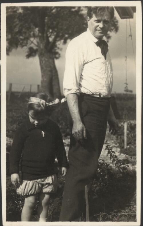 Walter Burley Griffin and young girl gardening in the backyard of "Lippincott", Heidelberg, Victoria, 1918 [picture]