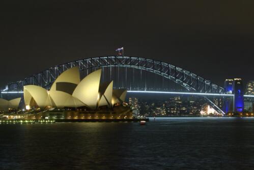 The Sydney Opera House and Sydney Harbour Bridge illuminated by night lights, 18th March, 2007 [picture] / Robert James Wallace