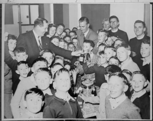 Jim Fraser entertaining children from the Goulburn Boys Orphanage, Goulburn, New South Wales, 1956 [picture]