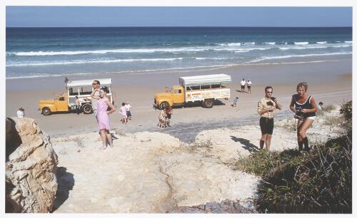 Tour buses delivering tourists daily to mine the coloured sands at Tewantin, Queensland, ca. 1970 [picture] / Jeff Carter
