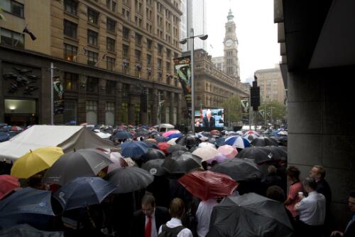 Sydney siders turned out in steady rain to witness via live TV the apology to the victims of the Stolen Generation delivered by Prime Minister Kevin Rudd, Martin Place, Sydney, 13 February 2008 [picture] / Karl Sharp