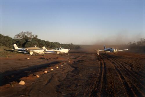 Three aircraft on an airstrip at Cape Leveque, Western Australia [picture] / Mervyn Bishop