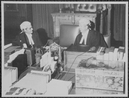J.A. Pettifer on left, and Douglas Blake at the head of the table in the House of Representatives, Canberra, ca. 1980 [picture]