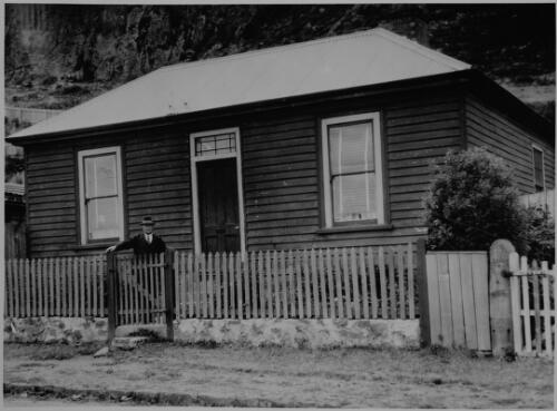 Joseph Lyons standing outside the cottage where he was born, Stanley, Tasmania, ca. 1935 [picture]