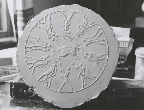 Sculptured medallion of Olympic motto, Melbourne, 1955 [picture]  / Australian News and Information Bureau