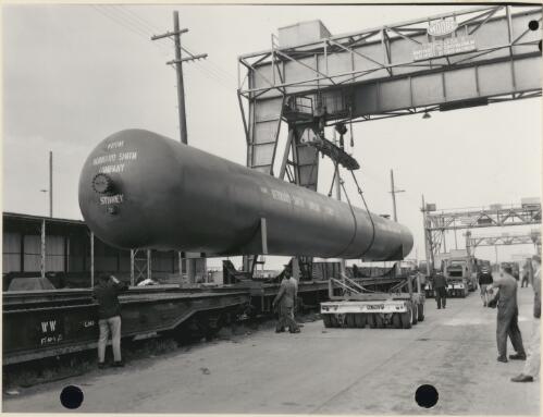 A 108 foot pressure cylinder is loaded on rail wagons in a marshalling yard in Sydney, October 1967 [picture]