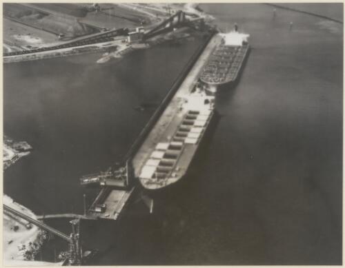 The  Eisho Maru with holds open to take ore at the Mount Newman Mining Co. pier at Port Hedland, August 1970 [picture]