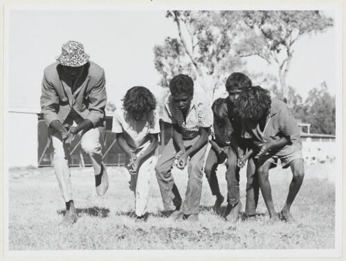 Bamyili pupils learn traditional dance from an Elder, Baymyili, Northern Territory, 1 November 1972 [picture] / Michael Jensen