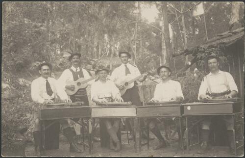 A group of German prisoners of war playing zithers and guitars in their national dress, Berrima Concentration Camp, New South Wales, ca. 1916 [picture]