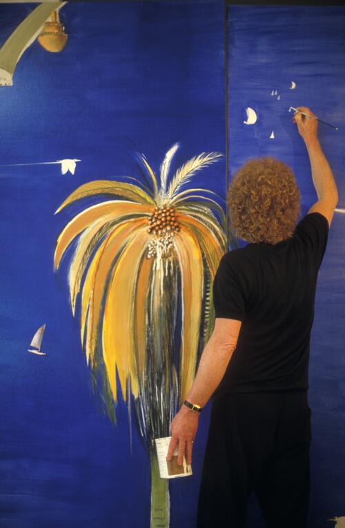 Australian artist Brett Whiteley adding detail with a paint brush to his artwork in his Surry Hills studio, Sydney, ca. 1988 [picture] / Philip Quirk