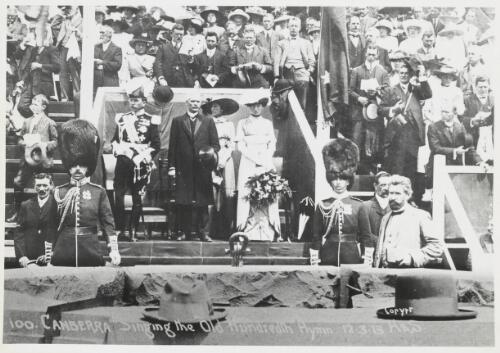 Prime Minister Andrew Fisher and Lord and Lady Denman standing for the singing of the Old Hundredth during the Canberra naming ceremony, 12 March 1913 [picture] / H&S