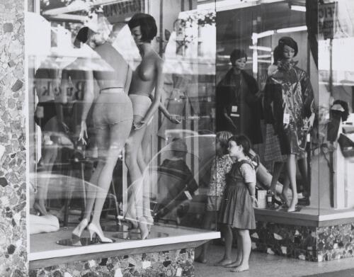 Barefoot girls looking at unclad display mannequins in the window of a fashion store near Buckingham's department store, Oxford Street, Sydney, ca. 1966 [picture] / Ted Richards