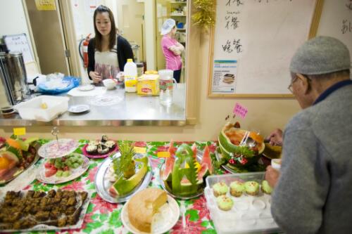 Display of lunch buffet, including watermelon, sponge cake and cupcakes, during Christmas celebrations at Elderly Chinese Home, Parkville, Victoria, 13 December, 2009 [picture] / Dave Tacon