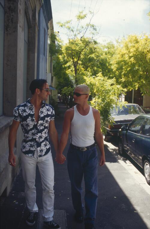 Gay partners holding hands in Taylor's Square, Darlinghurst, Sydney, 1998 [picture] / C. Moore Hardy