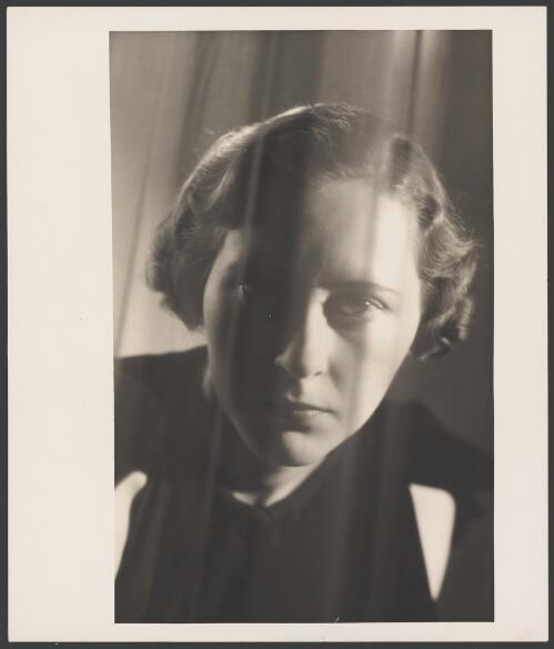 Portrait of a woman behind a curtain, ca. 1935 [picture] / Max Dupain