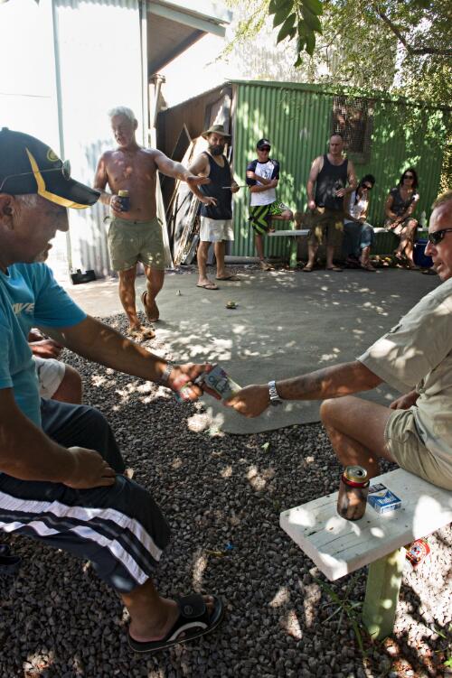 Residents of Maningrida playing two-up on Anzac Day, Arnhem Land, Northern Territory, 25 April 2010 [picture] / Dave Tacon