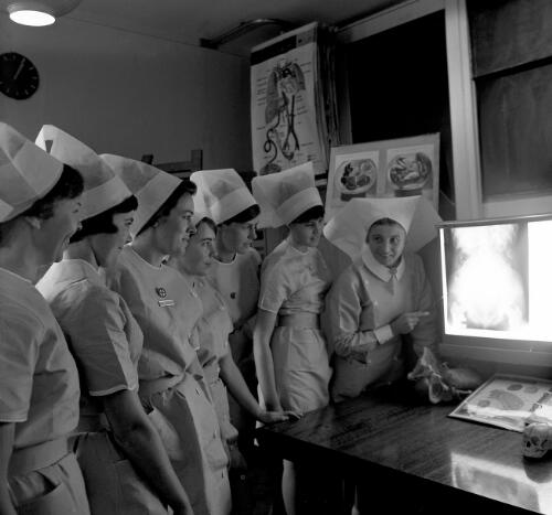 Maternity nurses viewing X-rays at King George V Memorial Hospital, Sydney, 10 October 1969 [picture] / Ern McQuillan