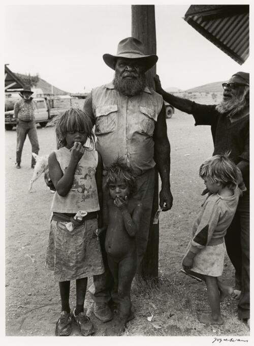 Jimmy Mukatji and three Aboriginal children, Pipalyatjara, South Australia, 1987 [picture] / Joyce Evans