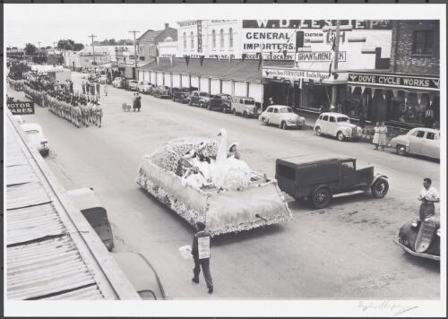 Float and RAAF contingent in street parade during the Annual Carnival, Sale, Victoria, 14 February 1953 [picture] / Douglas Thompson