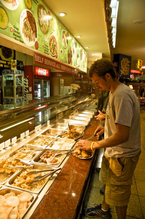 Customer using self service counter at a fast food outlet in Chinatown, Little Bourke Street, Melbourne, 14 January 2008 [picture] / Robin Smith