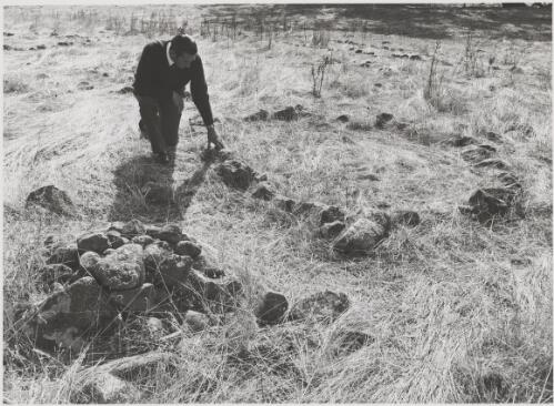 Archaeologist inspecting Aboriginal stone circles, south-eastern Australia, 2 June 1976 [picture] / Eric Wadsworth