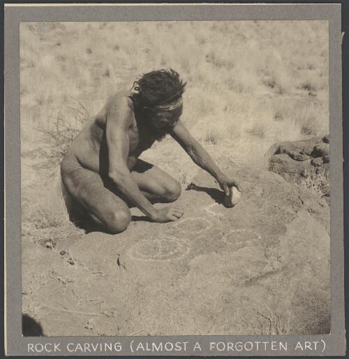 Aboriginal man rock carving, Arnhem Land, Northern Territory, 1948 [picture] / Harrison Howell Walker