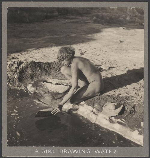 Young Aboriginal woman collecting water in a bark bowl, Arnhem Land, Northern Territory, 1948 [picture] / Harrison Howell Walker