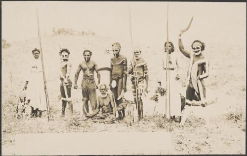 Aboriginal men in ceremonial body paint, two Aboriginal women and an older man with a boomerang [picture]