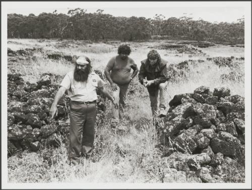 John King of the Gournditch-Jmara Language showing John Evans, right, and Rex Morgan, left, Aboriginal fish traps in central Victoria, Victoria, 23 April 1985 [picture] / John McKinnon