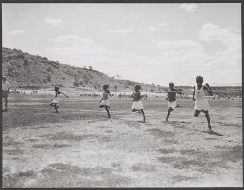 Young Aboriginal boys about to cross the finish line in a sprint, Alice Springs, Northern Territory, 1958 [picture] / W. Pedersen