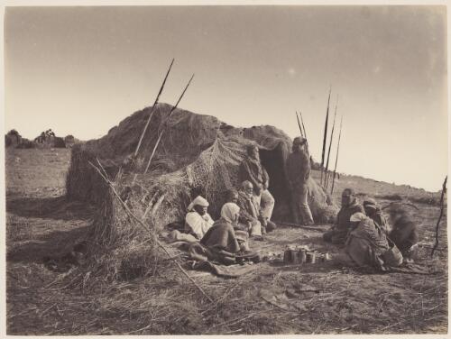 Aboriginal community seated around a fire at their camp, South Australia, ca. 1880 [picture] / Capt. Sweet