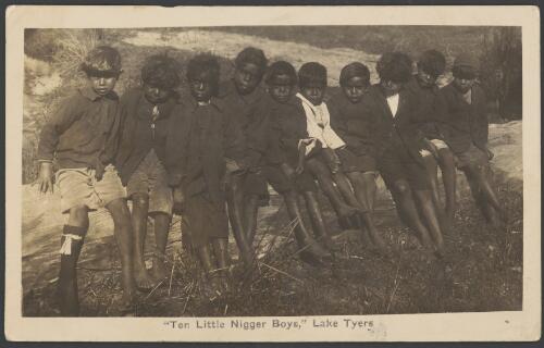 Ten young Aboriginal boys sitting on a log at the Lake Tyers Mission, Lake Tyers, Victoria, ca. 1910 [picture]