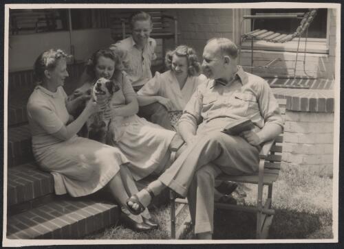 William McKell seated with his family and Mac the dog, prior to becoming Governor General of Australia, Sydney, 1947?