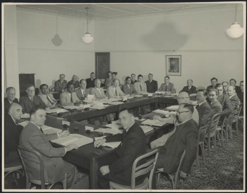 Group of delegates including Sir Stanley Carver at an economic forum, Hotel Canberra, Australian Capital Territory, circa 1950 / Australian News & Information Bureau Photograph