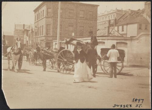 Horses and carts on Wharf Street near Pyrmont Bridge, Sydney, 1897