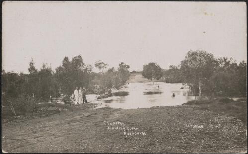 Three men standing at the ford, Harding River, Roebourne, Western Australia, approximately 1910 / Ernest Lund Mitchell