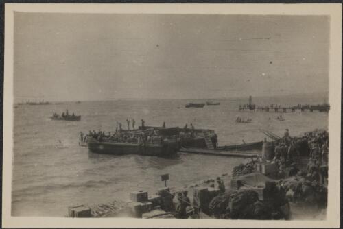 Troops unloading supplies from barges onto the beach, Gallipoli, 25 April 1915