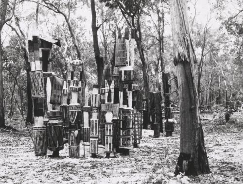 Pukamuni grave posts carved and painted, surrounding a grave, Snake Bay, Melville Island, Northern Territory, October 1948 [picture] / Axel Poignant