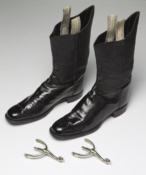 Hardy-style mid-calf black leather military riding boots and pair of disc rowel spurs, approximately 1930 / boots made by John Henry Homes