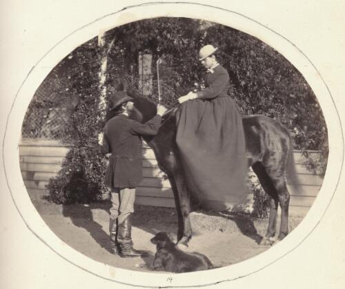 Woman on horseback riding side saddle in front of a verandah, Victoria [picture] / J. Chester Jervis
