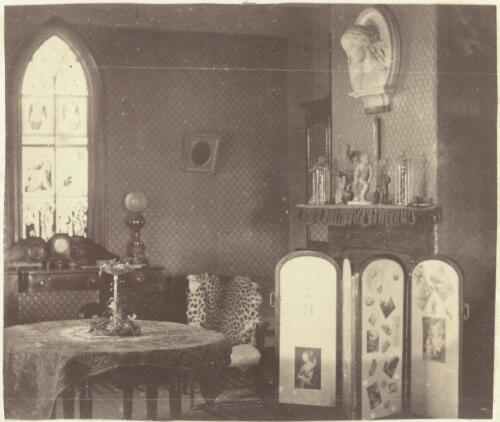 Drawing room interior with gothic stained-glass window and a screen [picture] / J. Chester Jervis