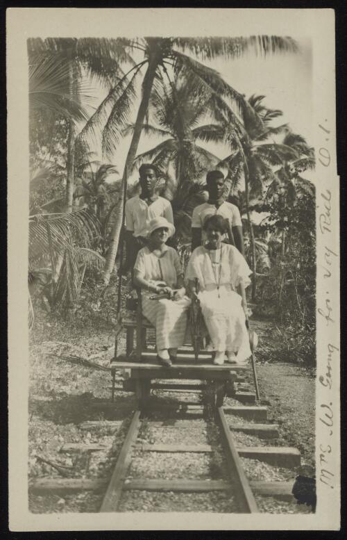 Mrs. Goward going for joy ride on a light rail dolly, Ocean Island, Kiribati, 1900-1917 [picture]