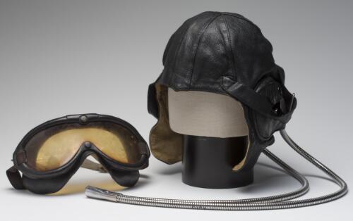 Air pilot's cap and goggles owned by Freda Thompson, 1934? [realia]